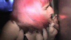 Wild young chick with pink hair blowing and banging gloryhole shafts