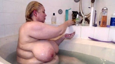 Big Boobed Blonde Masturbates With A Dildo In The Bathroom